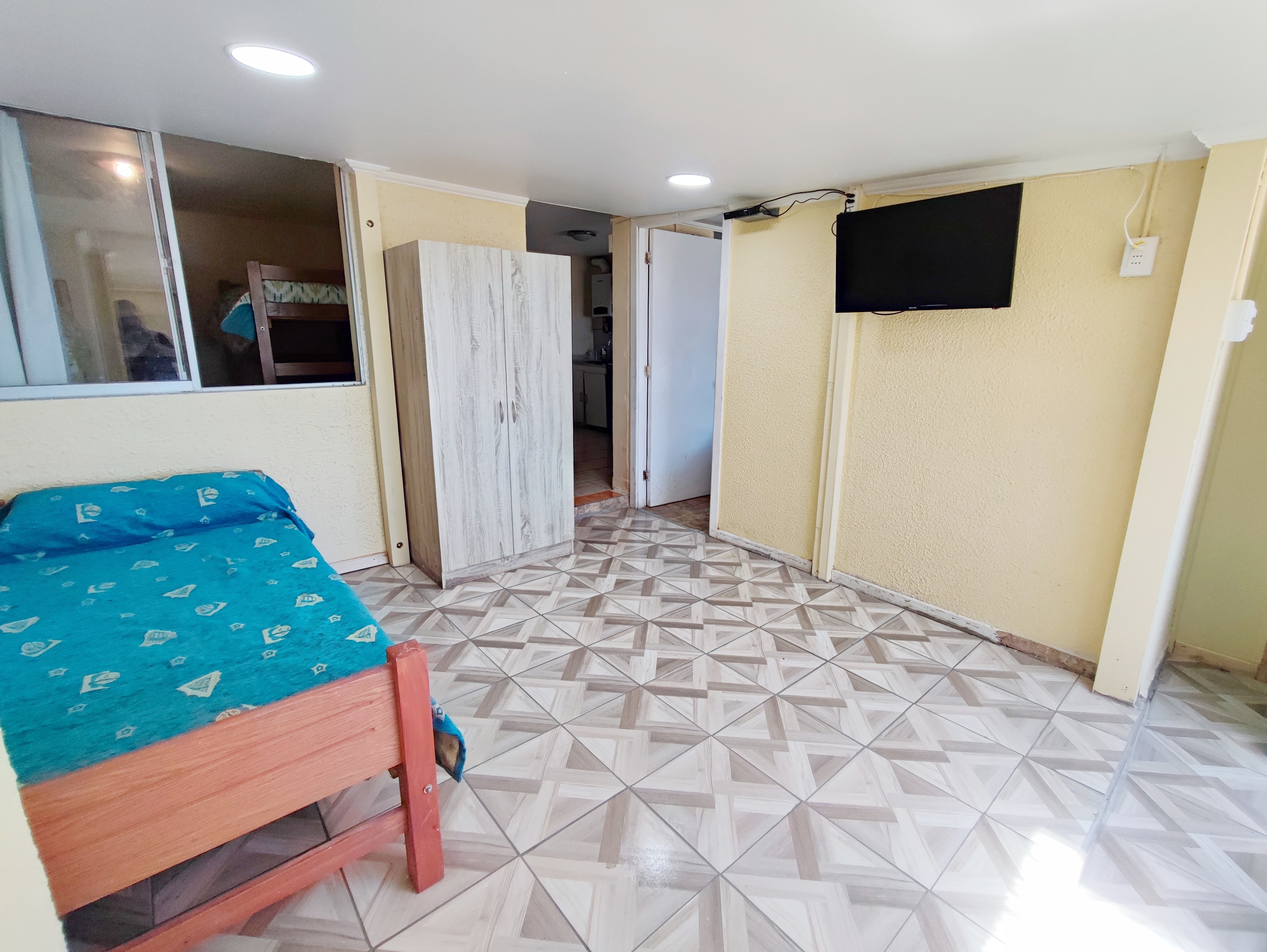 Sala de estar con sofá cama Cabaña 1
